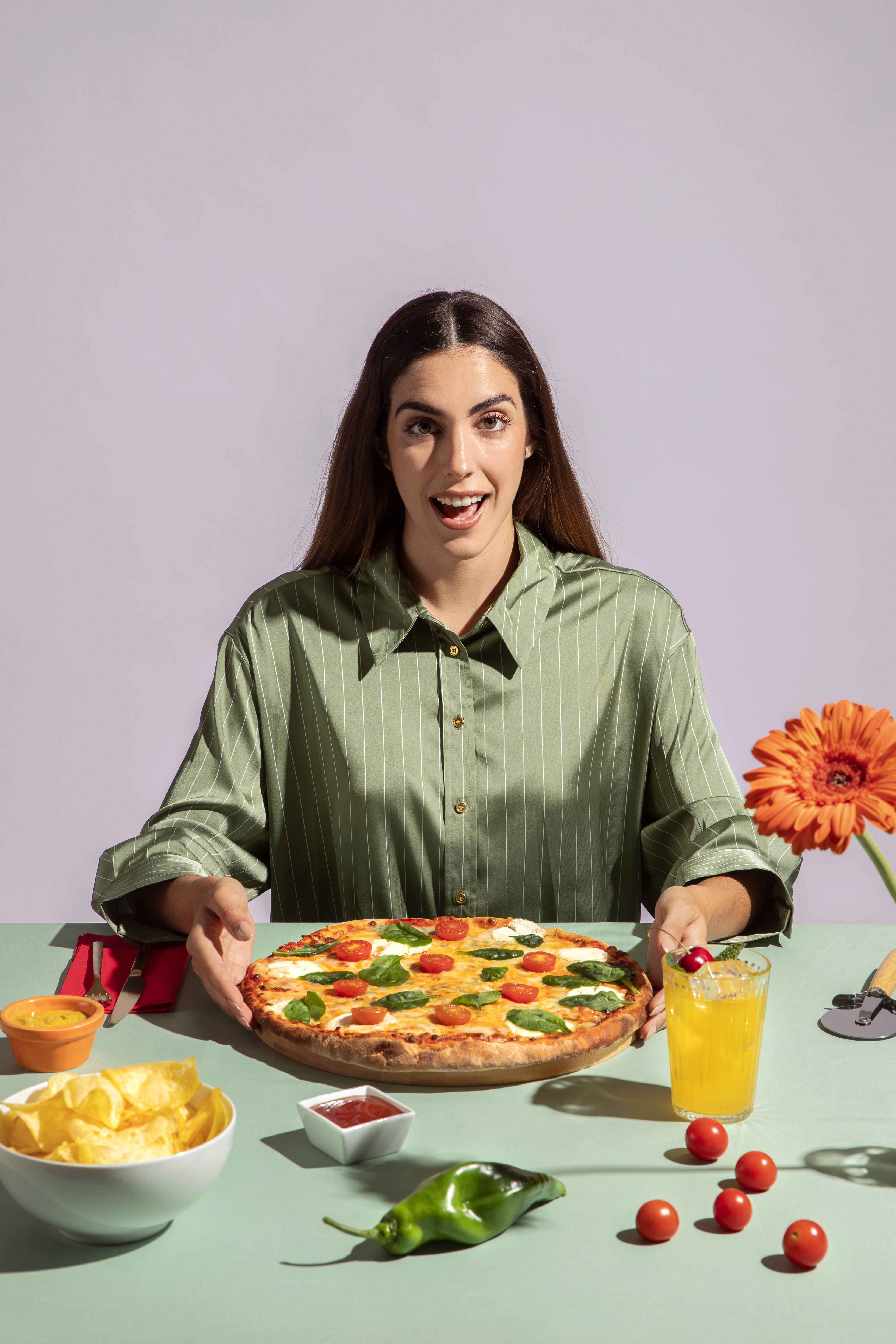 young-woman-enjoying-delicious-pizza